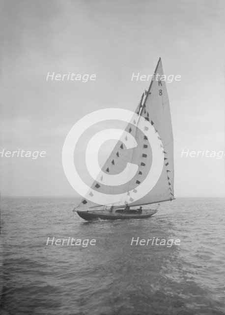 The 7 Metre sailing yacht 'Pinaster' (K8) with prize flags, 1912. Creator: Kirk & Sons of Cowes.