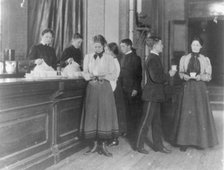 Students getting beverages from a counter, Western High School, Washington, D.C., (1899?). Creator: Frances Benjamin Johnston.
