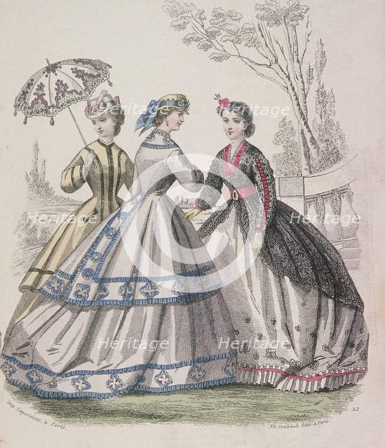 Three women wearing the latest fashions, one of the women is shading herself with a parasol, 1864. Artist: Anon