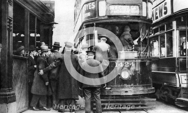 Getting on to a tram at Blackfriars, London, 1926-1927. Artist: Unknown