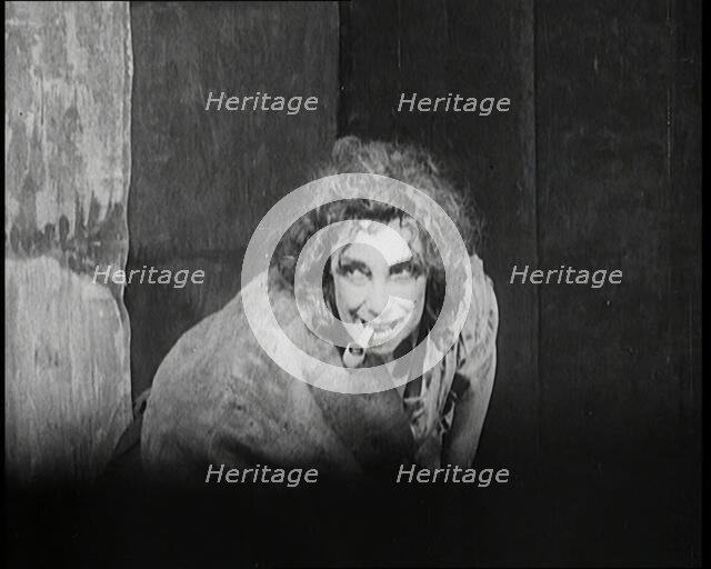 Helen Tree Performing in Heavy Makeup and Smoking a Pipe, 1922. Creator: British Pathe Ltd.