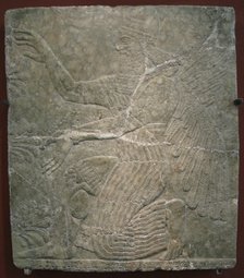Winged deity by the sacred tree. Relief from the palace of Ashurnasirpal II at Kalhu, Nimrud, 9th century BC. Artist: Assyrian Art  