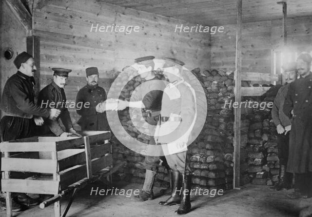 Giving Bread to British prisoners, between 1914 and c1915. Creator: Bain News Service.