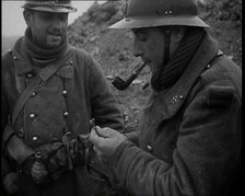 Two French Soldiers Standing in a Trench and One is Smoking a Pipe, 1939. Creator: British Pathe Ltd.