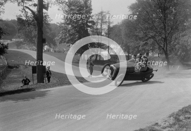 Austin 7 of B Sparrow about to crash, Donington Park Race Meeting, Leicestershire, 1933. Artist: Bill Brunell.