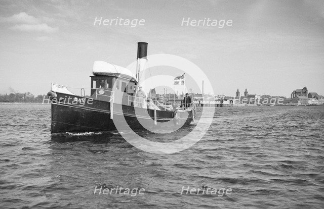The tugboat 'Ran' leaving Landskrona, harbour, Sweden, 1935. Artist: Unknown