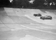 Austin 747 cc works racer and another car on the Members Banking at Brooklands. Artist: Bill Brunell.