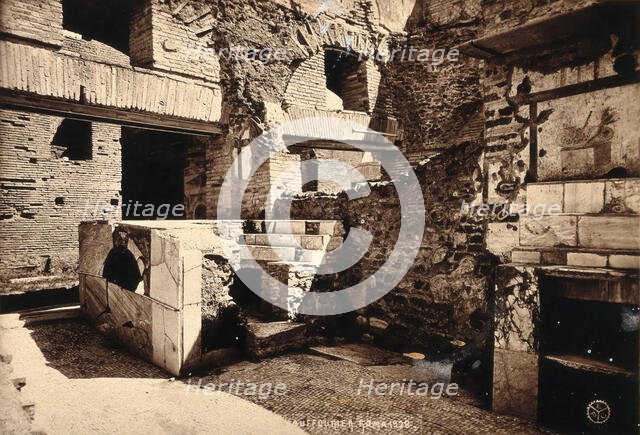 Partly ruined buildings in Ostia identified as a tavern or hot-food shop (thermopolium)..., 1928. Creator: Unknown.