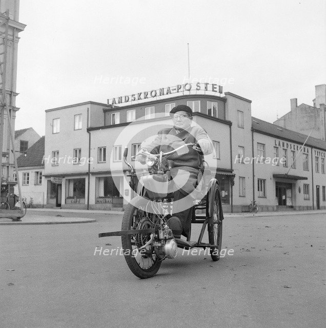 A disabled man with his motorised wheelchair, Landskrona, Sweden, 1952. Artist: Unknown