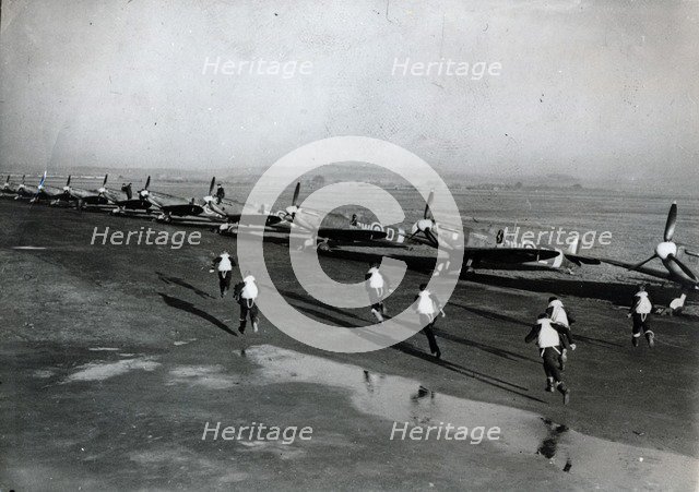 Pilots running to their aircraft, Battle of Britain, 1940. Artist: Unknown
