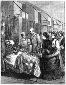 The queen visiting the wards of the London Hospital, late 19th century, (1900).Artist: G Durand