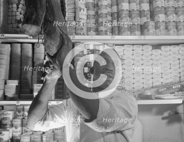Mr. J. Benjamin, a store owner, Washington, D.C., 1942. Creator: Gordon Parks.