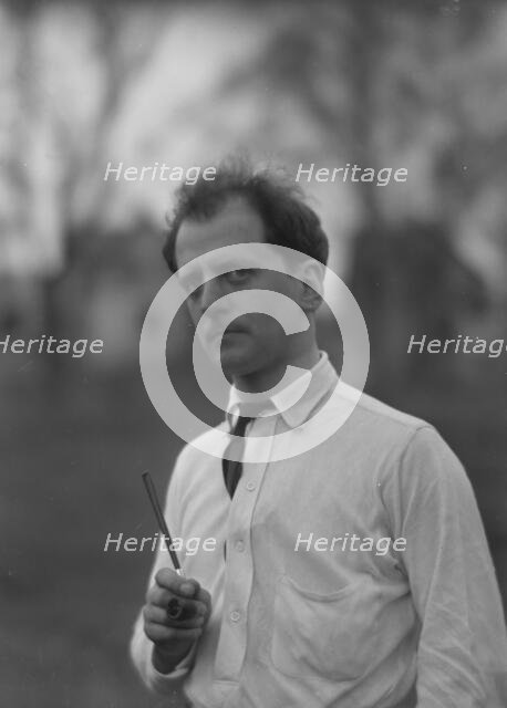 Kennerley, Mitchell, Mr., standing outdoors, 1914 or 1915. Creator: Arnold Genthe.