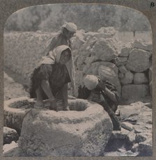 'Women drawing water at the Fountain of the Magi, on the road to Bethlehem', c1900. Artist: Unknown.