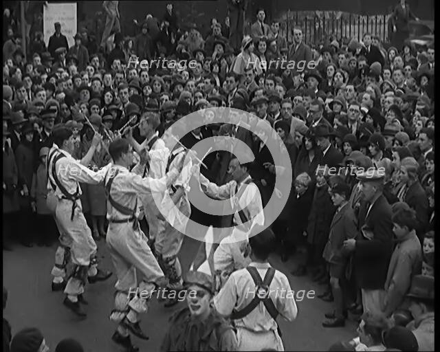 A Crowd of People Watching Morris Dancers Perform, 1931. Creator: British Pathe Ltd.