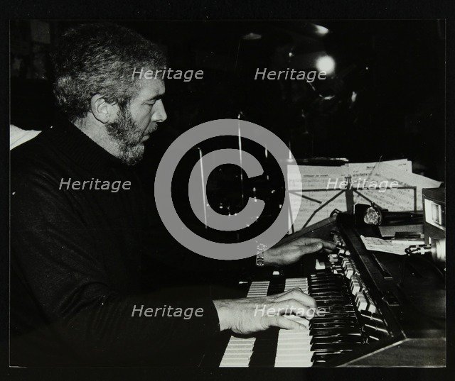 Ron Lohn playing the electronic organ at The Bell, Codicote, Hertfordshire, 22 February 1981. Artist: Denis Williams