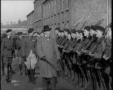 A British Man Inspecting Lines of Irish Auxiliary Soldiers, 1921. Creator: British Pathe Ltd.