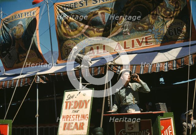 Barker at the grounds at the Vermont state fair, Rutland, 1941. Creator: Jack Delano.
