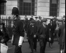 A Police Officer Guiding Traffic on the Streets of London, 1936. Creator: British Pathe Ltd.