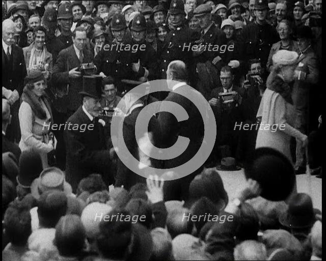 King George V and Other Well Dressed Men and Women Walking Through a Crowd with Photographers...1933 Creator: British Pathe Ltd.
