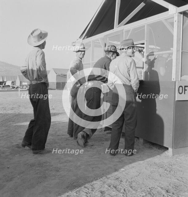 Applicants at registration tent on opening day...FSA camp, Merrill, Klamath County, Oregon, 1939. Creator: Dorothea Lange.