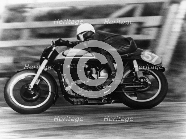A Norton in action in the Isle of Man TT, 1950. Artist: Unknown