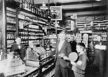 Unidentified grocery store, probably in Germany, between 1900 and 1910. Creator: Unknown.