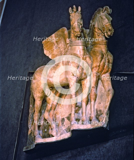Winged horses, carved on Etruscan terracotta.