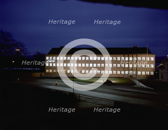 Exterior of an engineering industry building at night, Jönköping, Sweden, 1954. Artist: Göran Algård