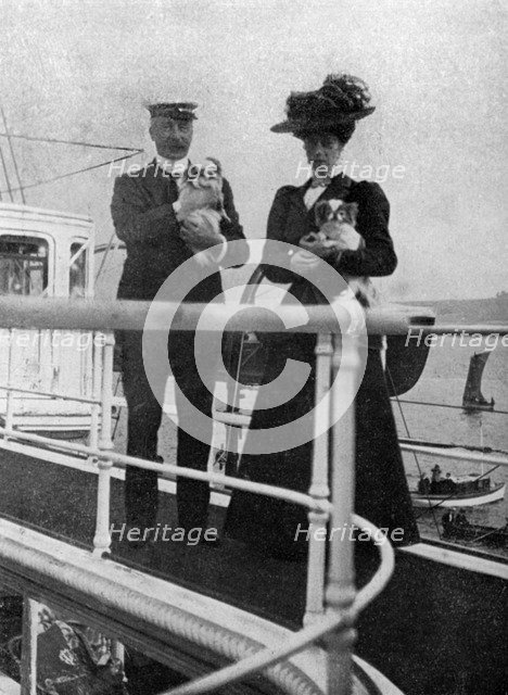 Princess Victoria (1868-1935) with the Queen's dogs, 1908.Artist: Queen Alexandra