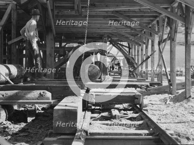 Possibly: The sawmill in operation, Ola self-help sawmill co-op, Gem County, Idaho, 1939. Creator: Dorothea Lange.