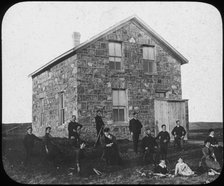 'A settler's abode', Canada(?), late 19th century(?). Artist: George Philip & Son Ltd