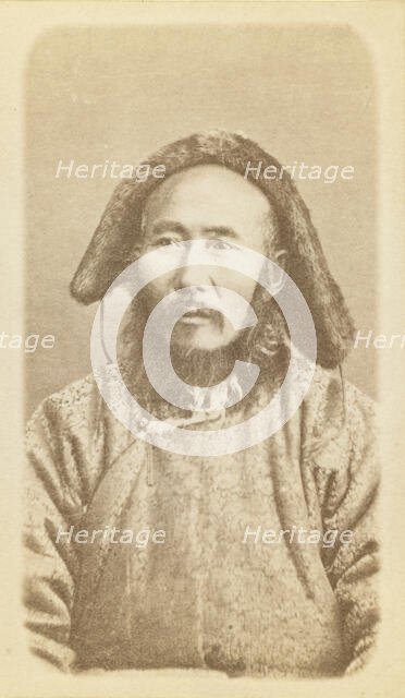 Half-length portrait of man, seated, facing slightly left, between 1870 and 1886. Creator: Unknown.