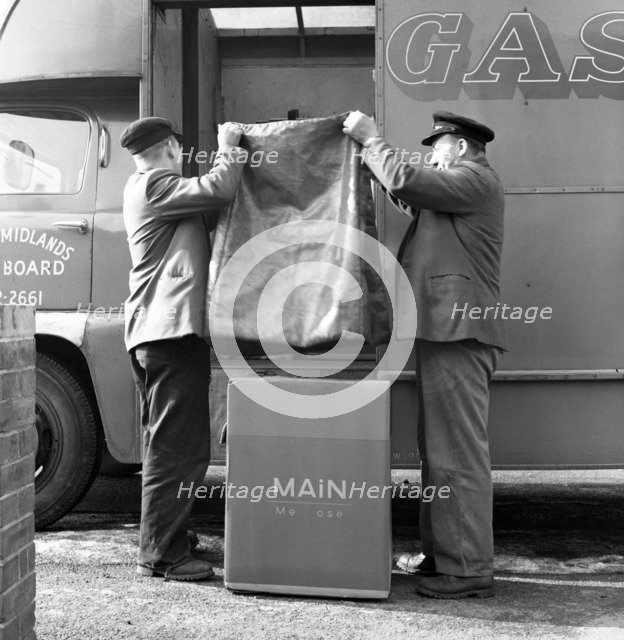 Home delivery of a cooker, Darfield, Barnsley, South Yorkshire, 1963. Artist: Michael Walters