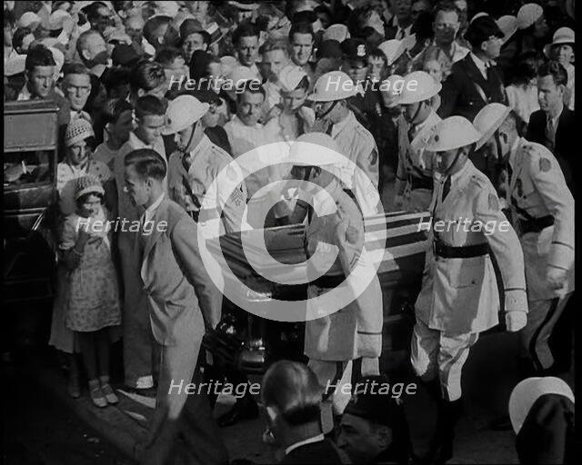Male American Soldiers in White Uniforms Carrying the Coffin of Anton Cermak, the Mayor of..., 1933. Creator: British Pathe Ltd.