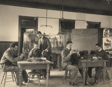 Students constructing telephones at Hampton Institute, 1899 or 1900. Creator: Frances Benjamin Johnston.