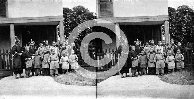 Fukien province, China: women and children outside a school (?), 1871. Creator: John Thomson.