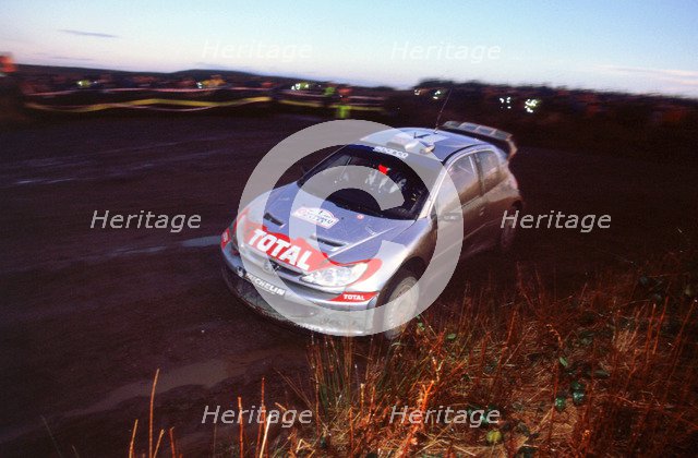 2002 Peugeot 206 WRC, Richard Burns, Network Q Rally. Artist: Unknown.