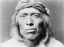 Head-and-shoulders portrait of Shiwawatiwa, a Zuni Indian, facing front, c1903. Creator: Edward Sheriff Curtis.