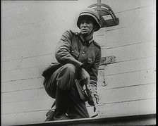 A Male German Army Soldier Holding a Polish Eagle Emblem Removed from the Wall of a Warsaw..., 1939. Creator: British Pathe Ltd.