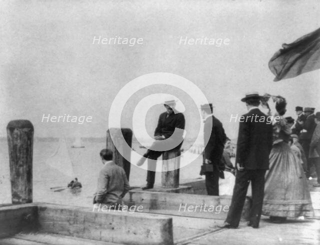 Group of well-dressed people on dock during yacht race, Oyster Bay, Long Island, N.Y., 1905. Creator: Frances Benjamin Johnston.