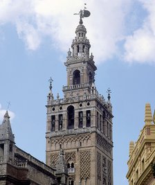 Giralda Tower in Seville, two-thirds are from 12th century in Almohad style and the top was finis…