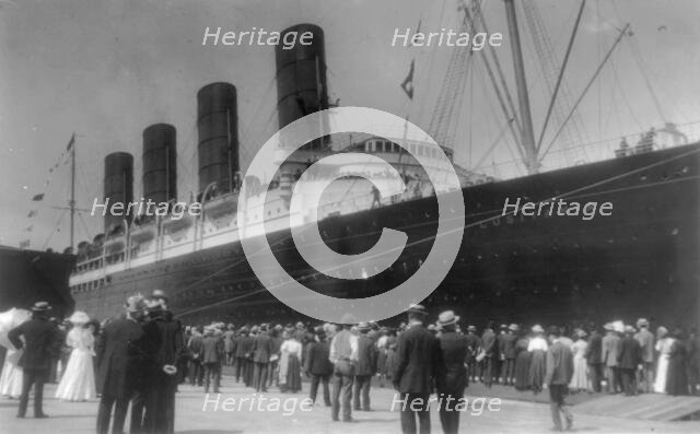 LUSITANIA arriving in N.Y. for first time, Sept. 13, 1907: starboard view; crowd at dock..., 1907. Creator: Frances Benjamin Johnston.