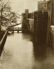 Flood waters in the moat at the Tower of London, 1928, (1935). Creator: Unknown.
