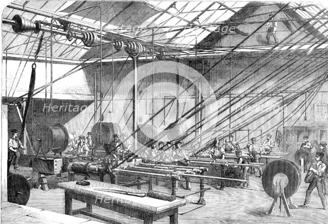 Machines covering with Gutta Percha the Atlantic Cable Wire, at the Gutta Percha Company's..., 1857. Creator: Unknown.