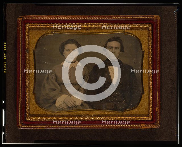 Unidentified man and woman, half-length portrait, seated, ca. 1855. Creator: Francis Grice.