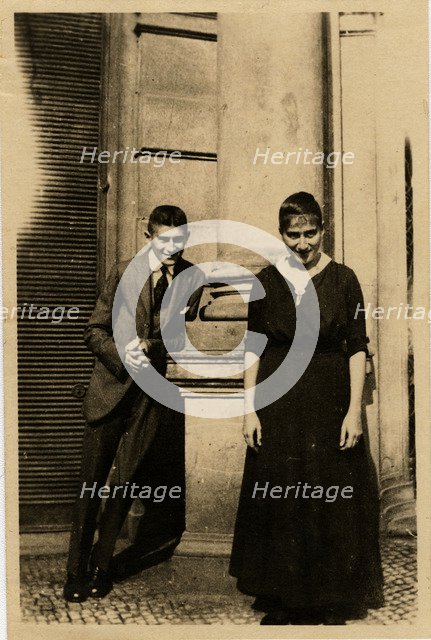 Franz Kafka with his sister Ottla before Oppelt House in Prague Artist: Anonymous  