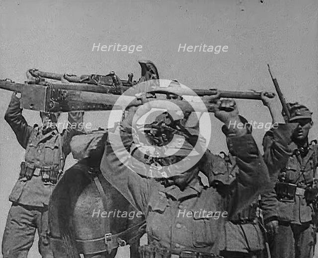 German Troops Carrying Equipment Through the Caucasus Mountains, 1943. Creator: British Pathe Ltd.