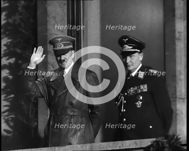 Adolf Hitler, the German Leader, Saluting the Crowd with Hermann Goering on the...,1937 Creator: British Pathe Ltd.