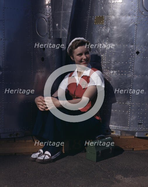 A noontime rest for a full-fledged...Long Beach, Calif., plant of Douglas Aircraft Company, 1942. Creator: Alfred T Palmer.